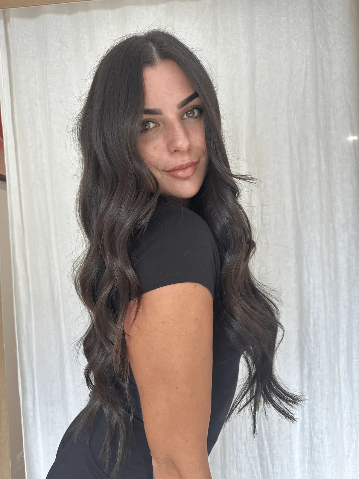 Long brunette hair with colour-matched weft extensions