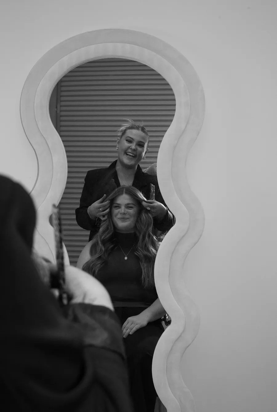 Behind the chair at By Willow, styling in the mirror